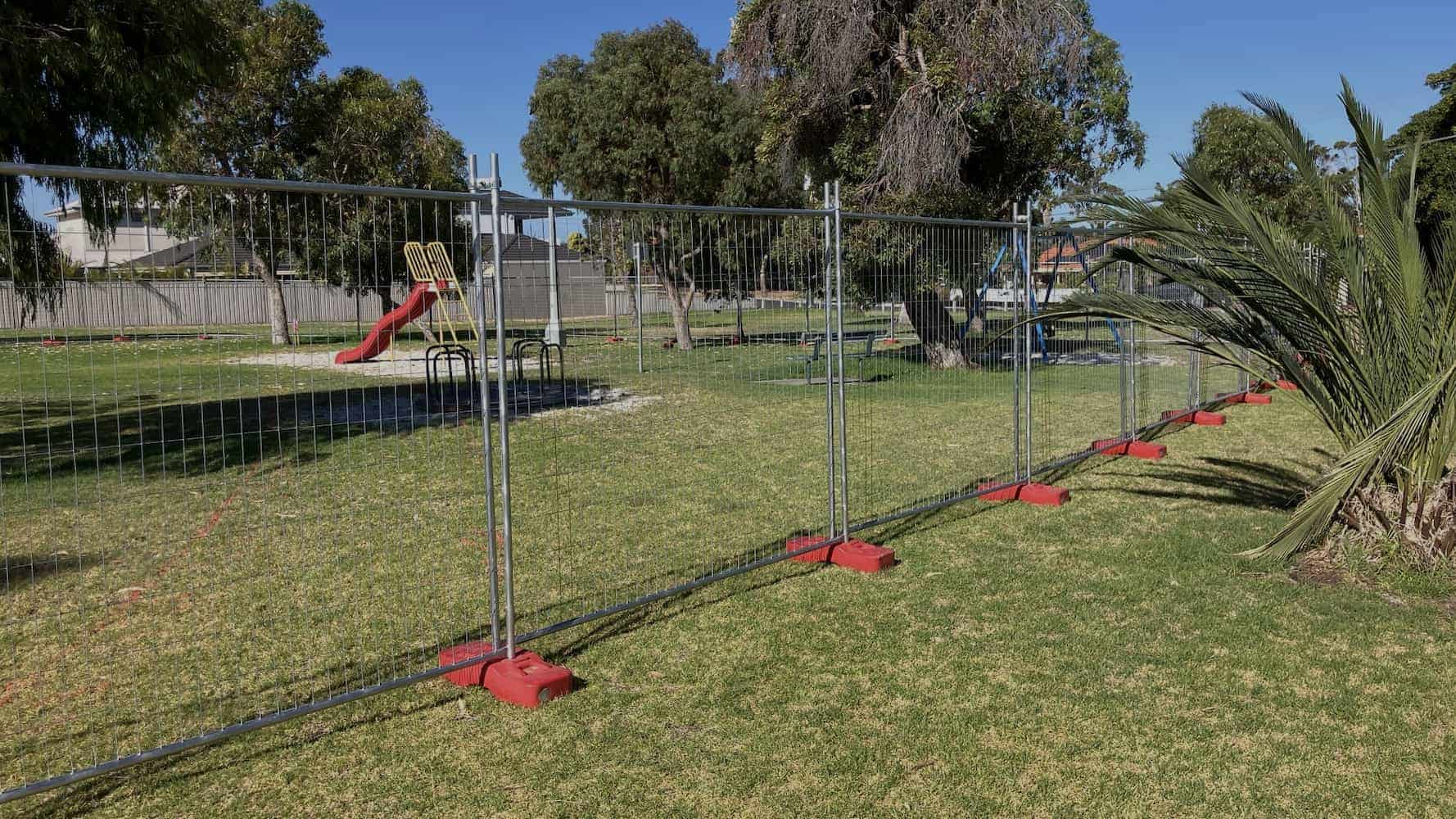 Temporary fencing in Perth enclosing a playground area, ensuring safety during maintenance or upgrades.