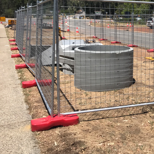 temporary fence with concrete feet at construction site